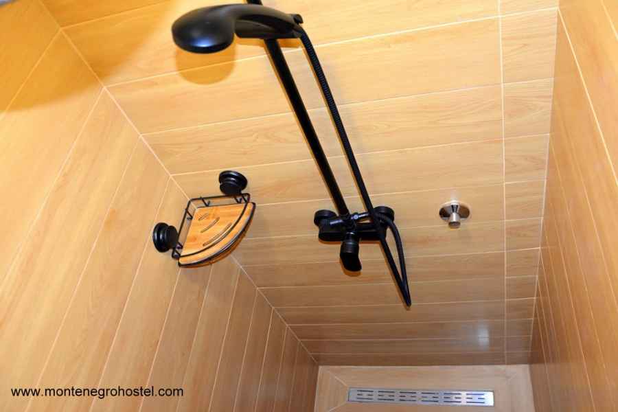 bathroom with showers
